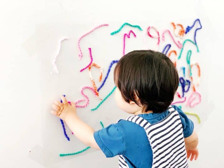 hello-wonderful-sticky-wall-yarn-activity-babies-toddlers9-720x540